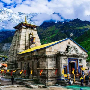 a stone building with a steeple and a steeple with Kedarnath Temple in the background,Kedarnath Temple