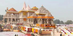 a large white building with colorful decorations, ram mandir